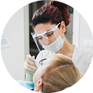 Dental expert examines a patient's teeth